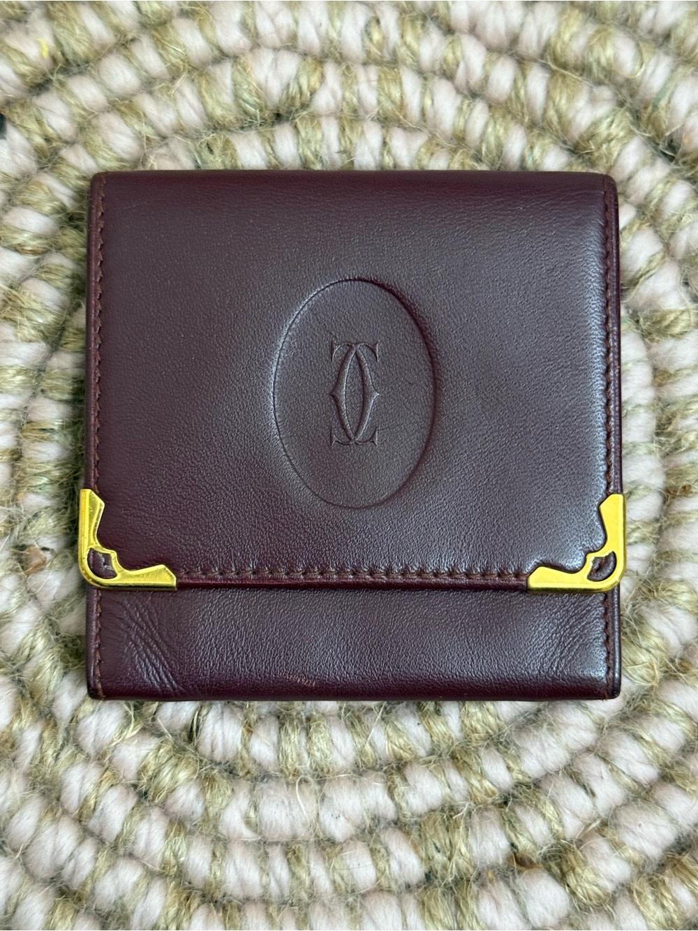 Cartier Deep Burgundy Leather Compact Wallet with Gold Accents